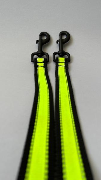 A Happy Hounds 6m lead with 2 attachment points and multiple "hold loops" to suit your / your dog's pull energy made with yellow high quality, high visibility webbing photographed on a grey background.