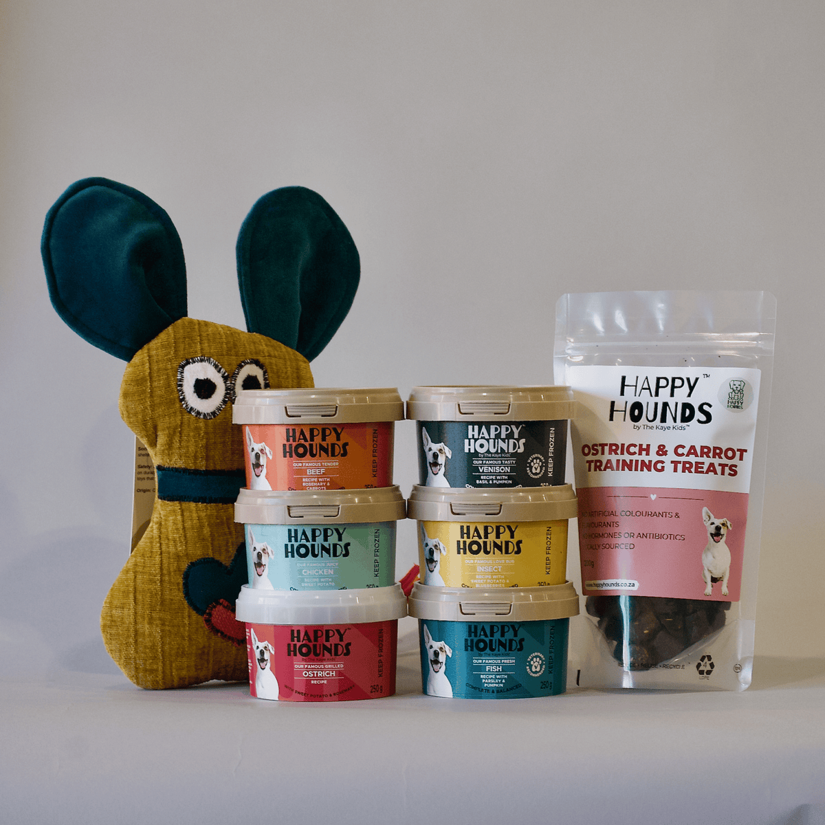 Happy Hounds Puppy Pack which includes a soft toy, fresh food and ostrich & carrot training treats