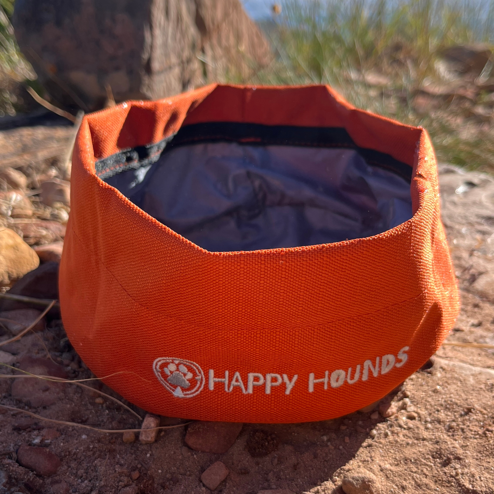 Happy Hounds orange trail bowl made from  super light, cloth that can fold up and be transported easily. 