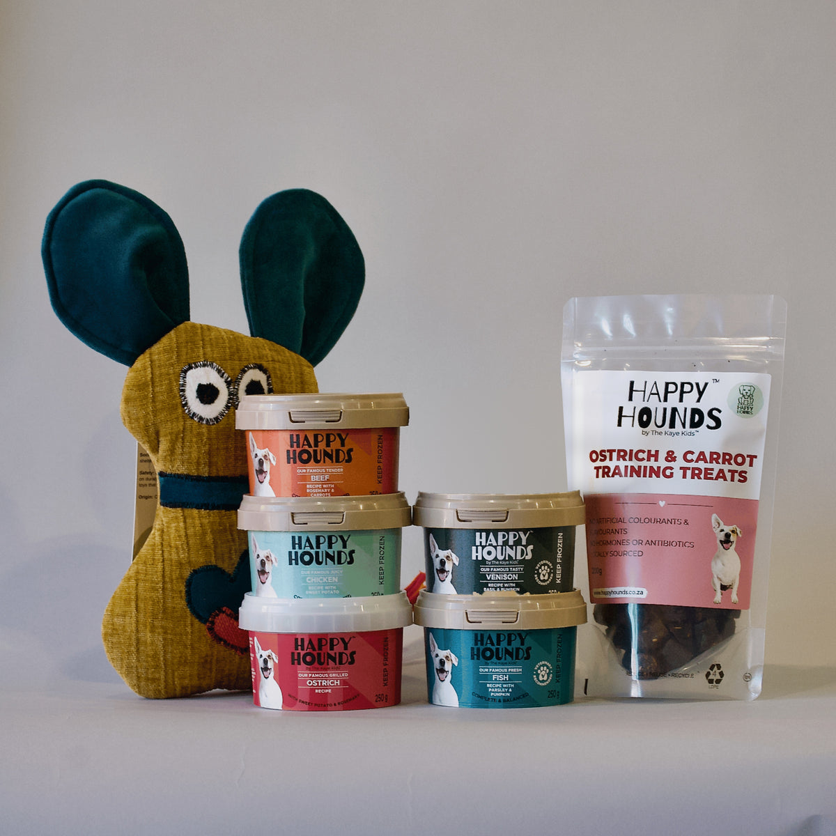 Happy Hounds Puppy Pack which includes a soft toy, fresh food and ostrich &amp; carrot training treats